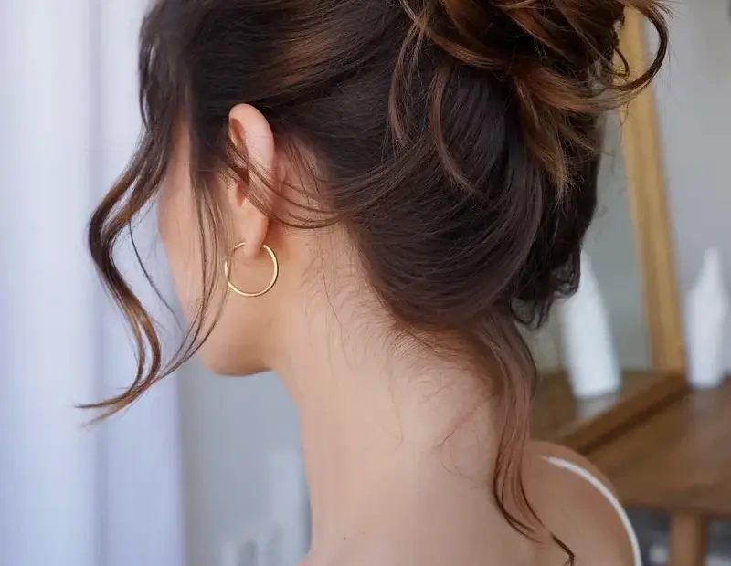 Elegant Messy Updo with Loose Tendrils - Bridal Hair Inspiration from Behind